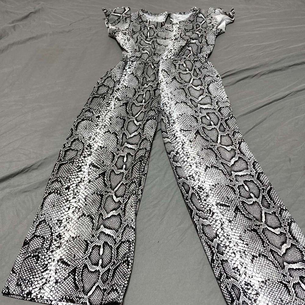 A black and gray snake print romper